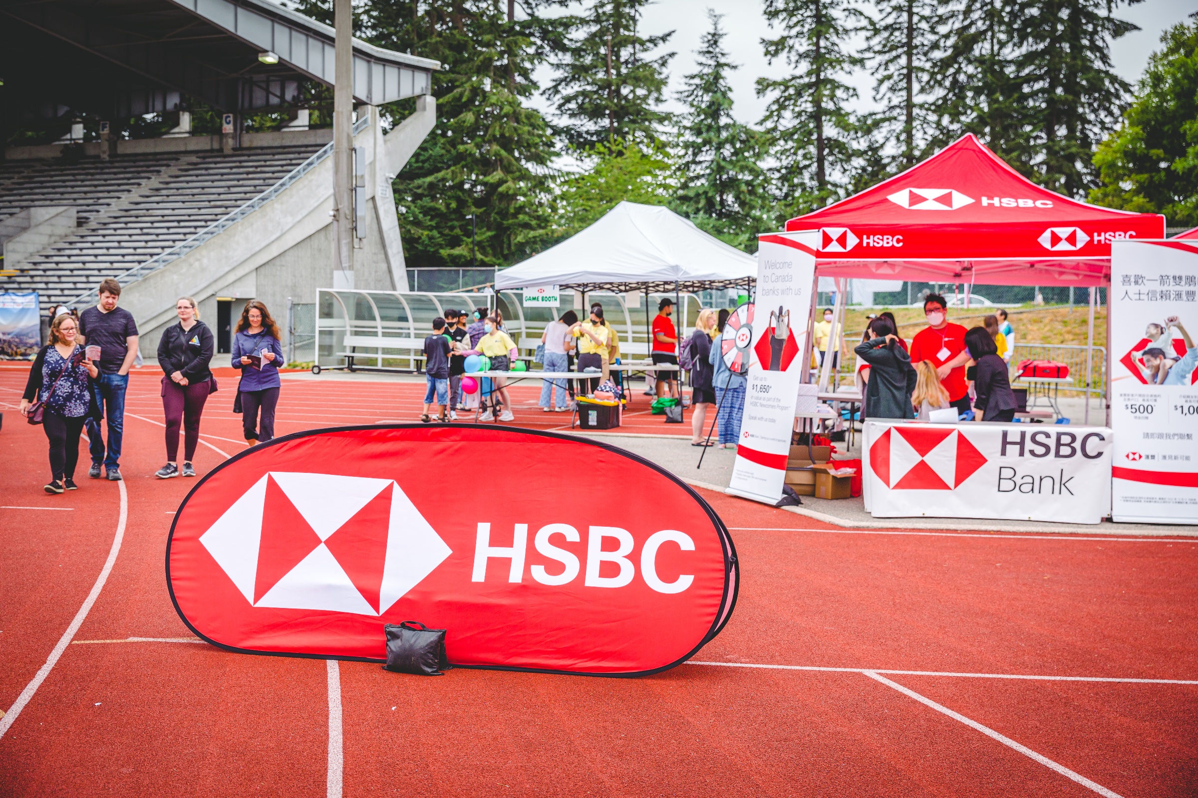 Festival crowd in front of sponsor branding